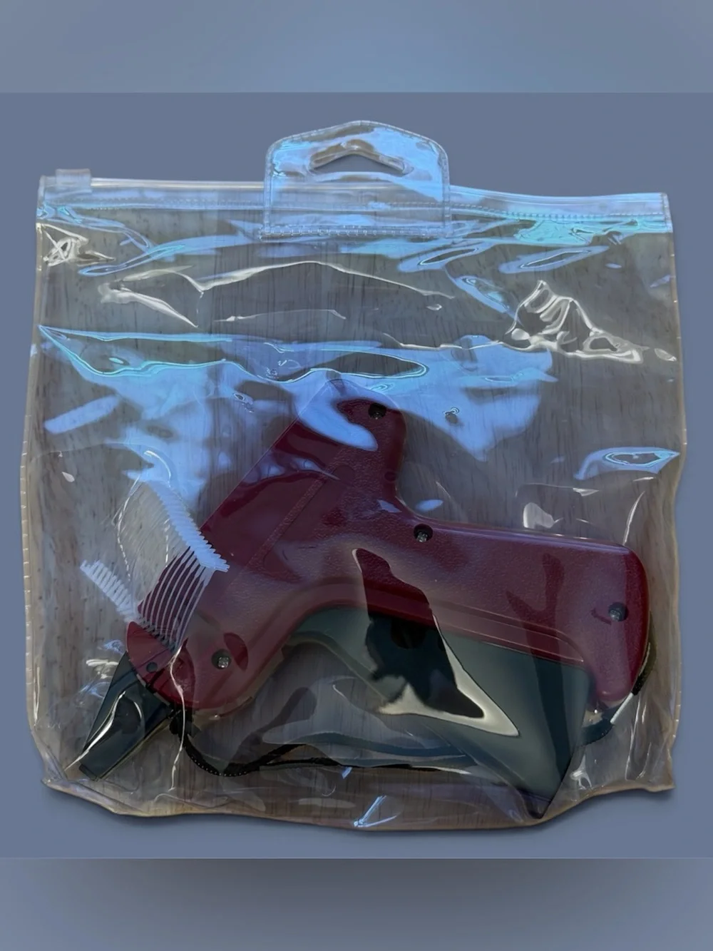 Burgundy Tagging Gun with Black Handle for Easy Price Labeling